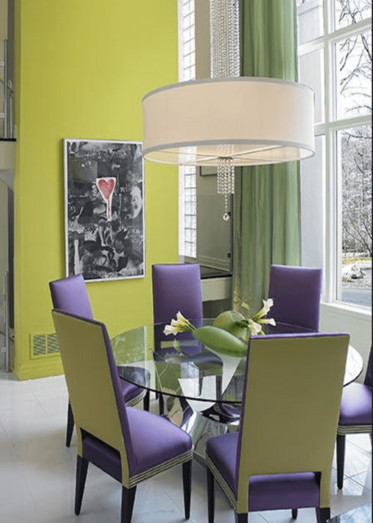 The stunning purple and lime green dining room is contemporary and sophisticated. The drum shade light fixture is amazing.