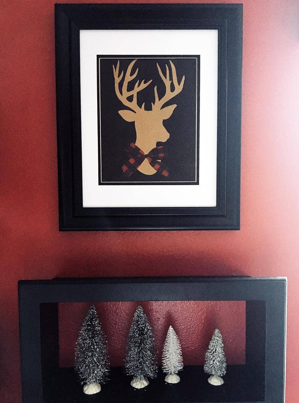 Use gift bags in unexpected ways. I cut off the handles and framed this deer for boy's bedroom Christmas art.