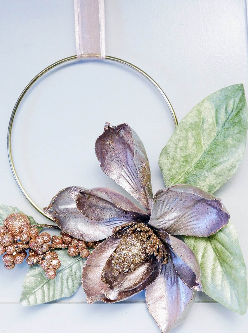 Diy this easy blush pink hoop ring wreath for less than $5. Great Idea for decorating on a budget.